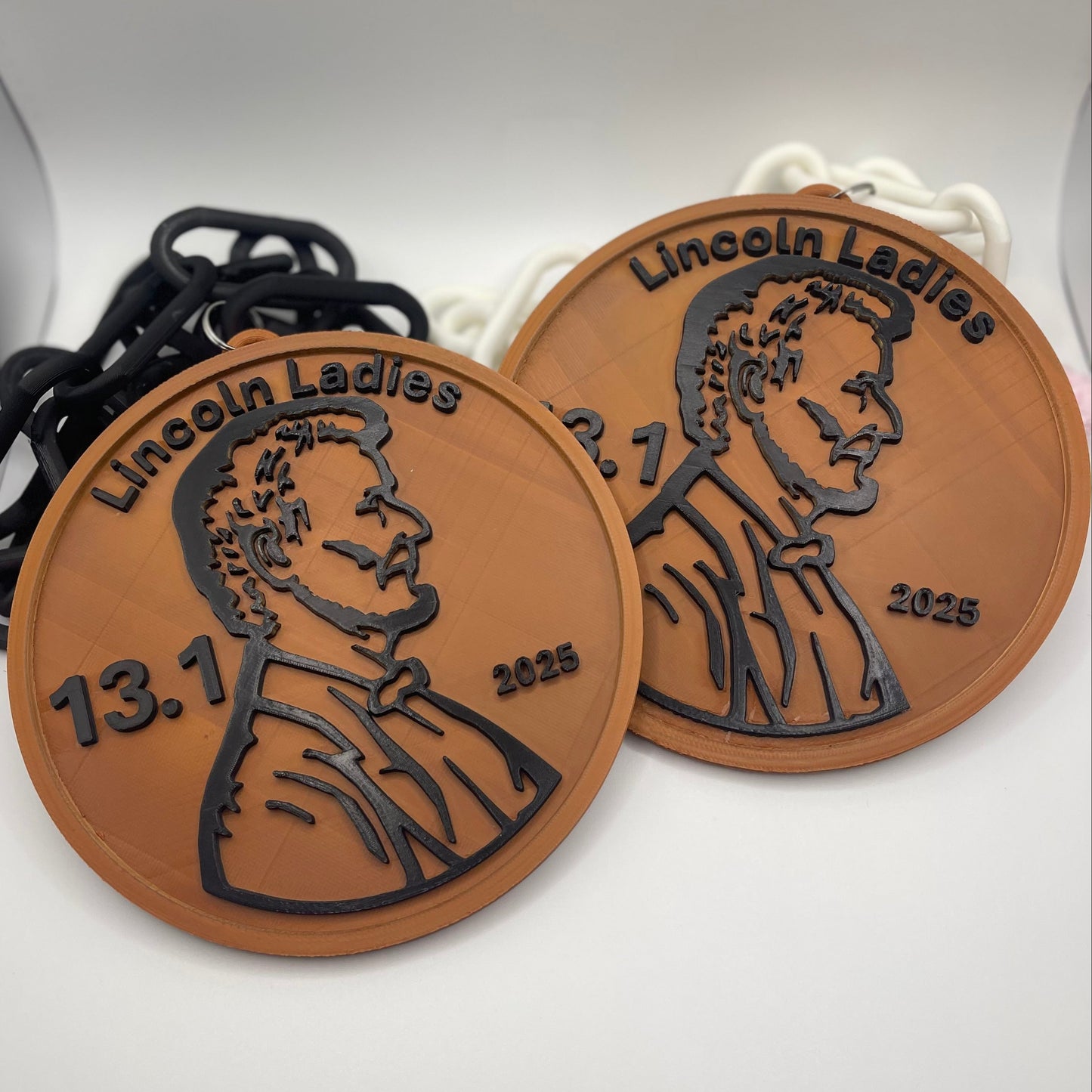 Two bronze lincoln penny hype chain pendants