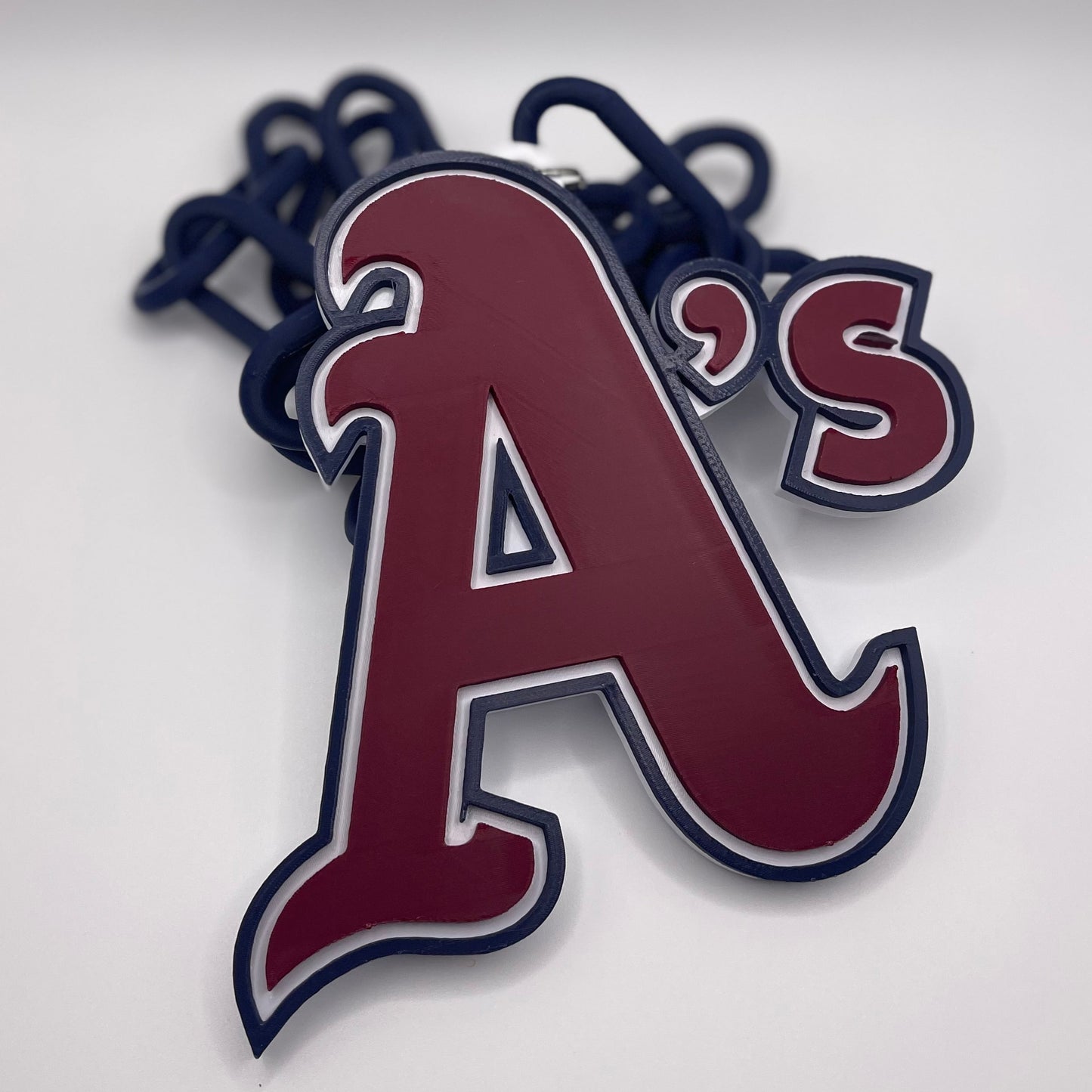 Keychain with 'A's' logo on a white background
